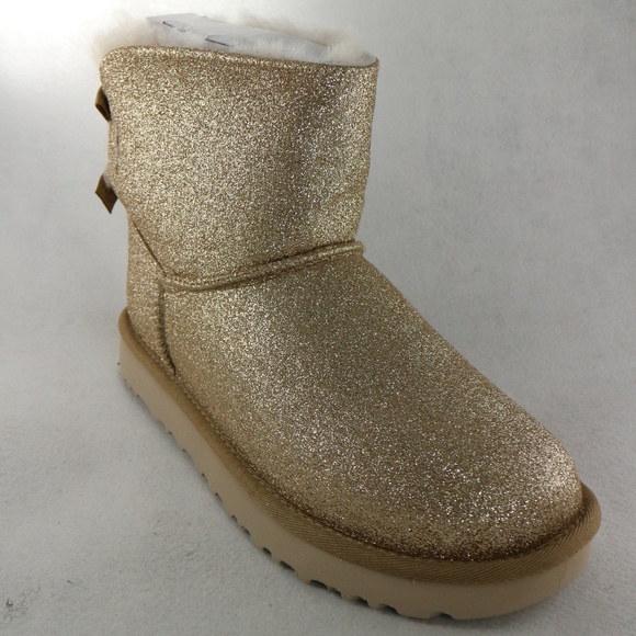 UGG Shoes - UGG Womens Mini Bailey Bow GOLD Sparkle Boots NEW Sz 7